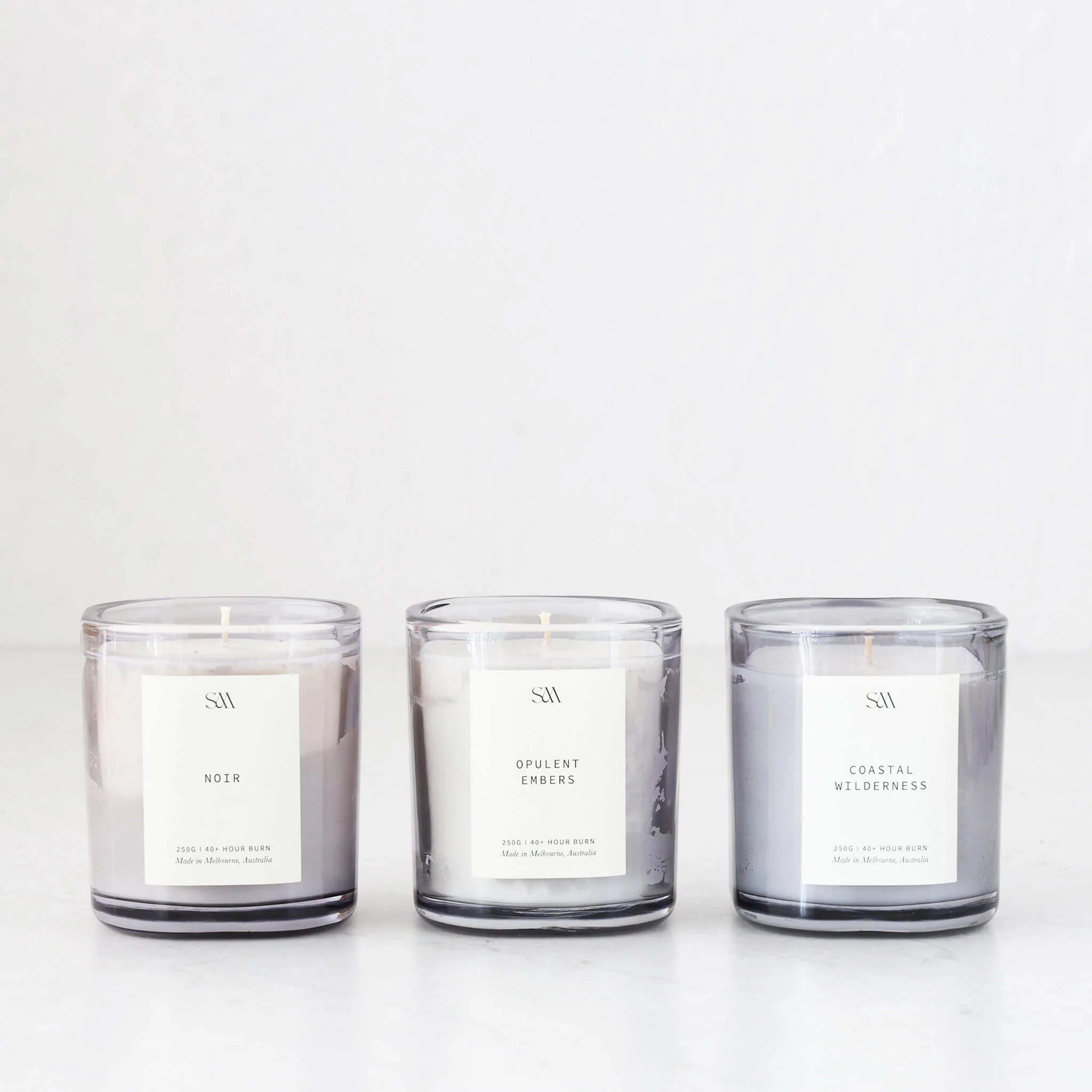 STUDIO MCKENNA | SIGNATURE BOX SET OF 3 CANDLES | NOIR + COASTAL WILDERNESS + OPULENT EMBERS - Image 8